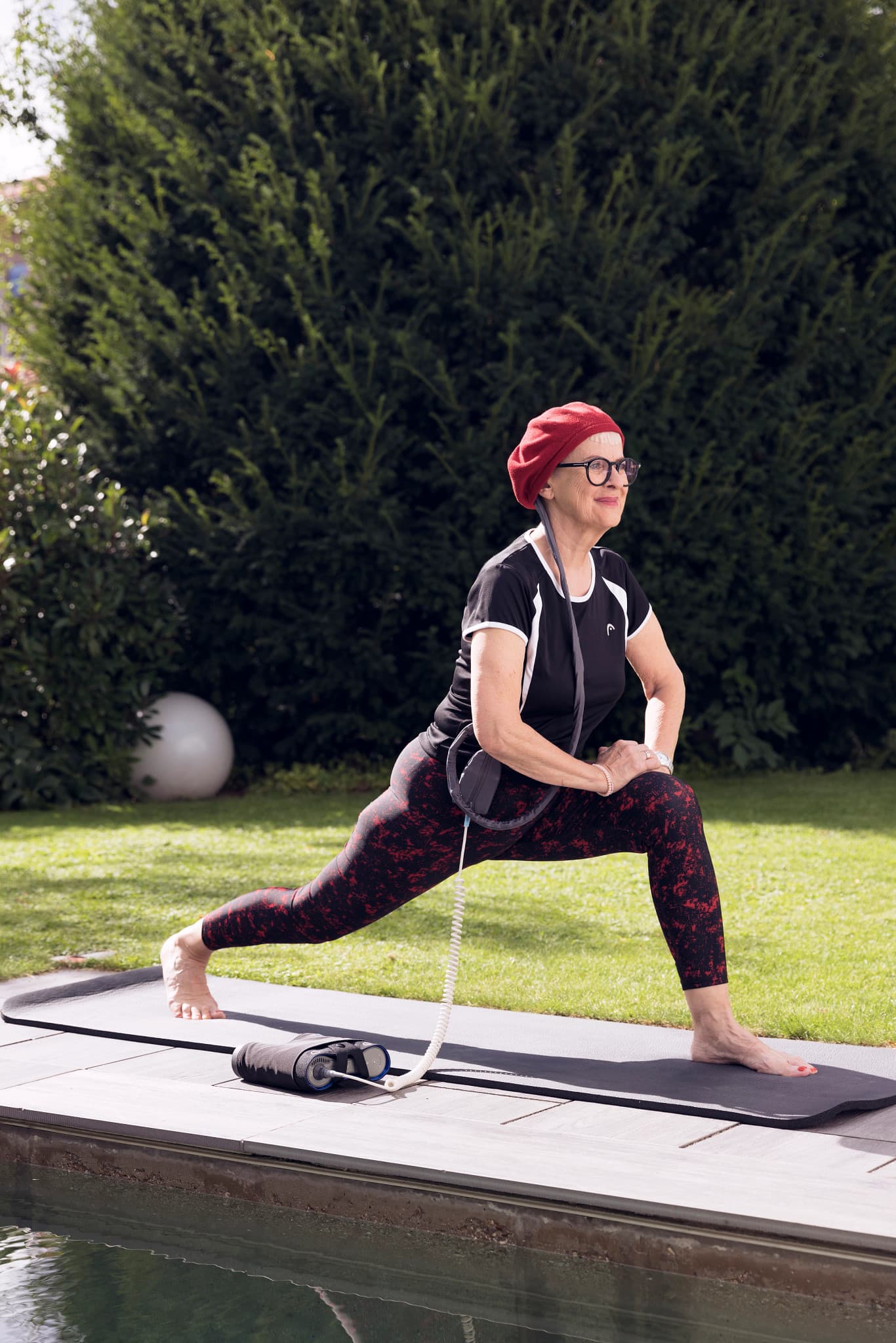 Smiling man in casual jacket standing outdoors with city background, natural light photography
