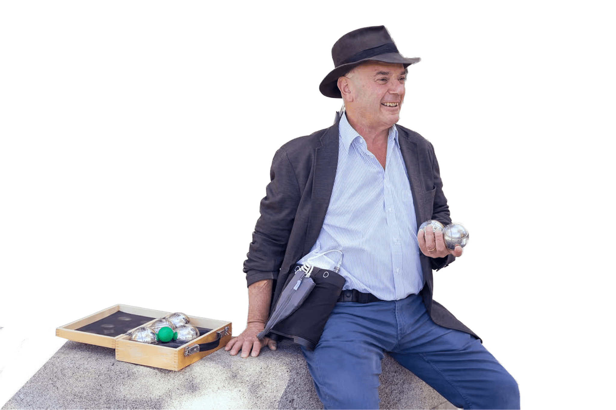 Smiling man with a shaved head wearing a white shirt in outdoor setting